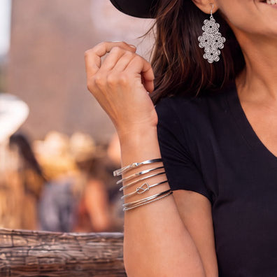Product image featuring the Bandera Stackable Bangles in silver.​