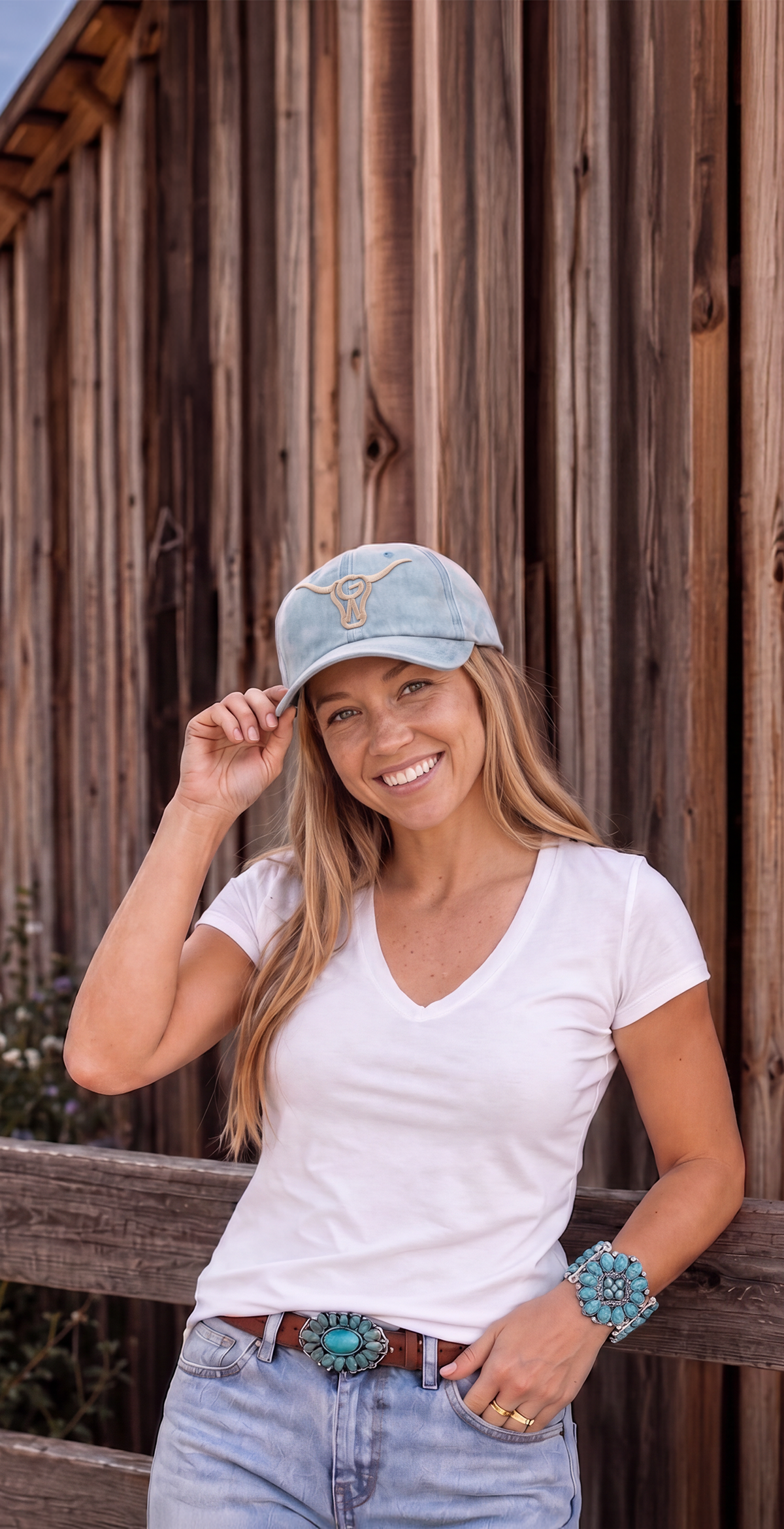 A woman in Western-inspired style wearing the Turquoise Crown Cuff.​