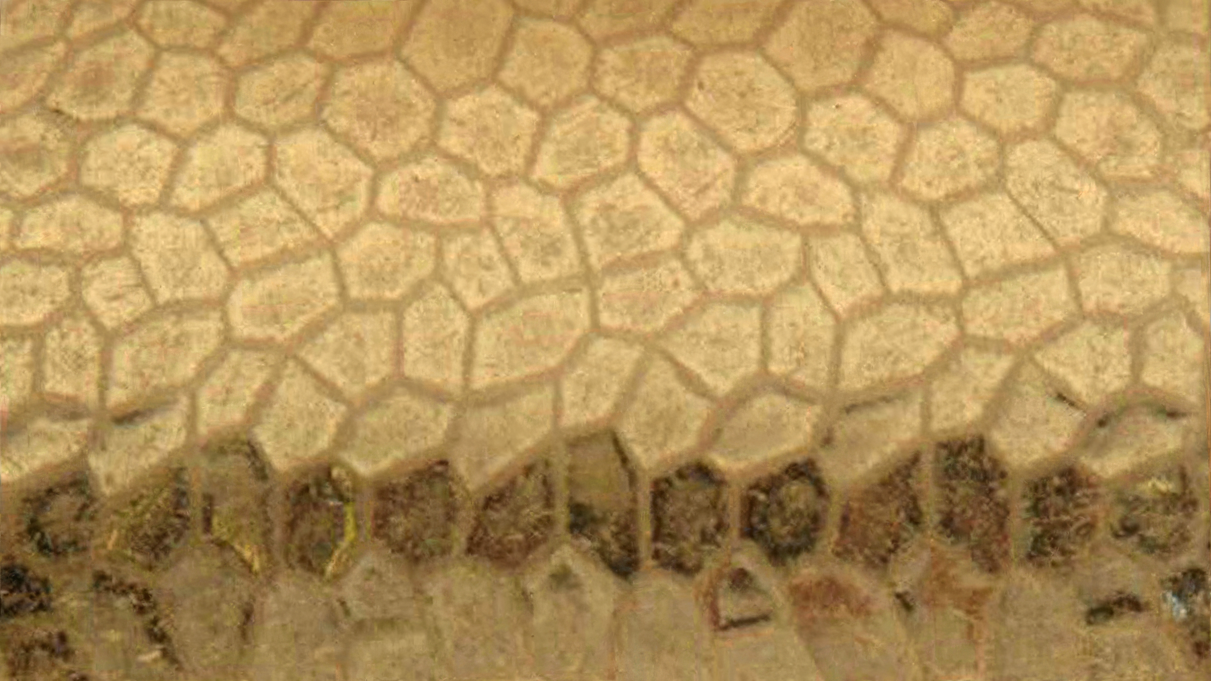 A close cropped image of a gold metal bracelet