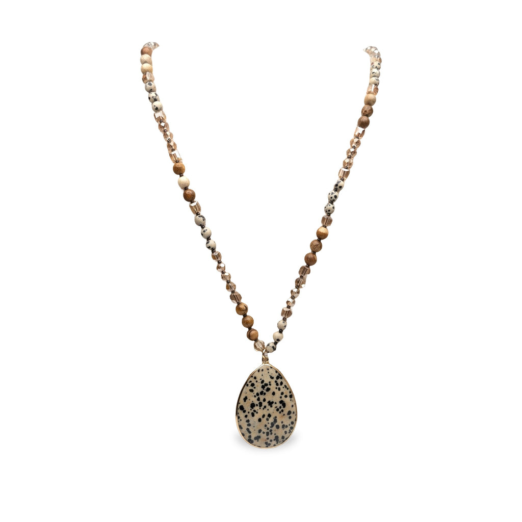 Desert Stone Necklace — Dalmation Beige arranged in a draped flat lay.​