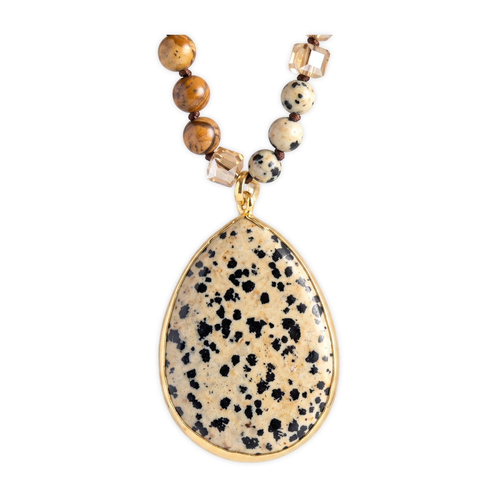 Close-up of the pendant on Desert Stone Necklace — Dalmation Beige.​