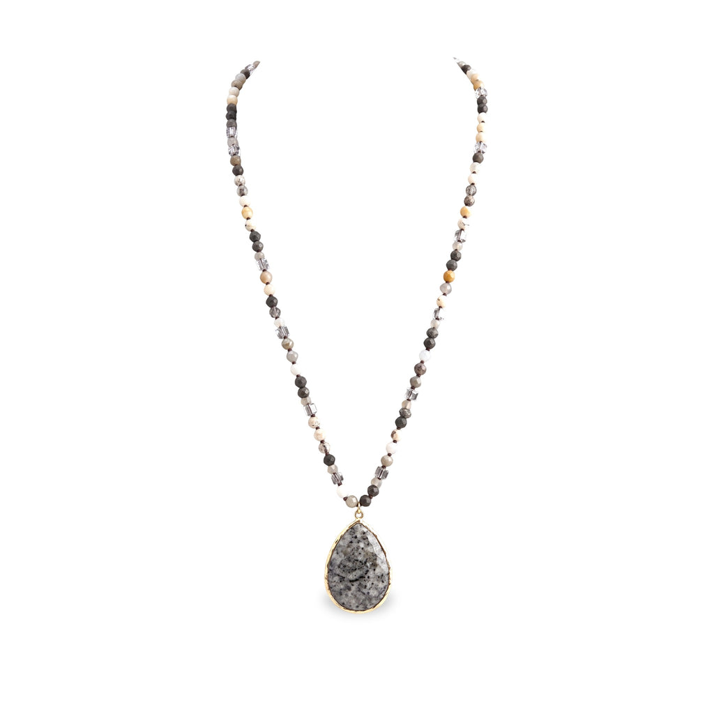 Desert Stone Necklace — Dalmation Gray arranged in a draped flat lay.​