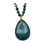 Close-up of the pendant on Desert Stone Necklace — Turquoise.​
