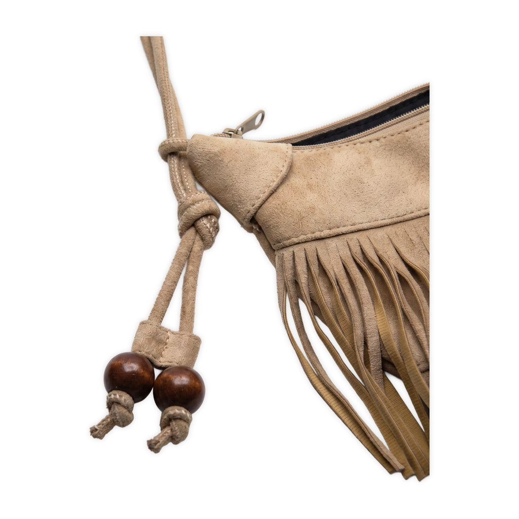 Close-up of the strap hardware on River Run Fringe Bag — Beige.​