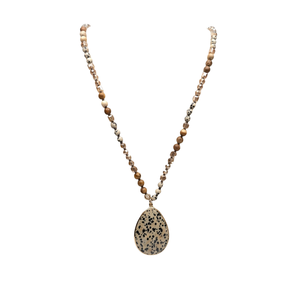 Desert Stone Necklace — Dalmation Beige arranged in a draped flat lay.​
