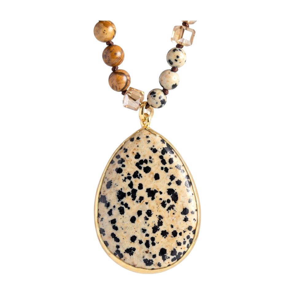 Close-up of the pendant on Desert Stone Necklace — Dalmation Beige.​